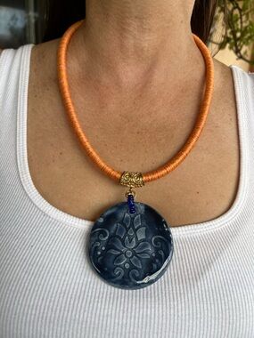 Handmade Orange Cord Necklace with Navy Blue Floral Pendant